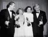 Hollywood, California: Left to right are--Douglas Fairbanks, Jr., Claire Trevor, Jane Wyman, and Walter Huston, four winners of the academy Awards. Fairbanks accepted the award for Laurence Olivier for Best Actor and Best Picture of the Year; Trevor received the Best Supporting Actress award; Wyman was the Best Actress of the Year; and Huston won the Best Supporting Actor award.